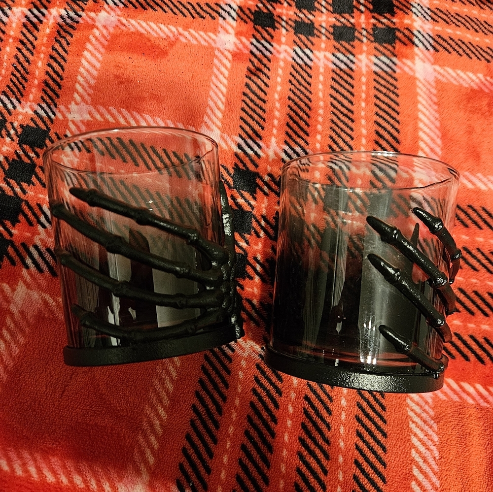 Source Unknown Black Glass Candle Holders with Skeleton Hand Accent